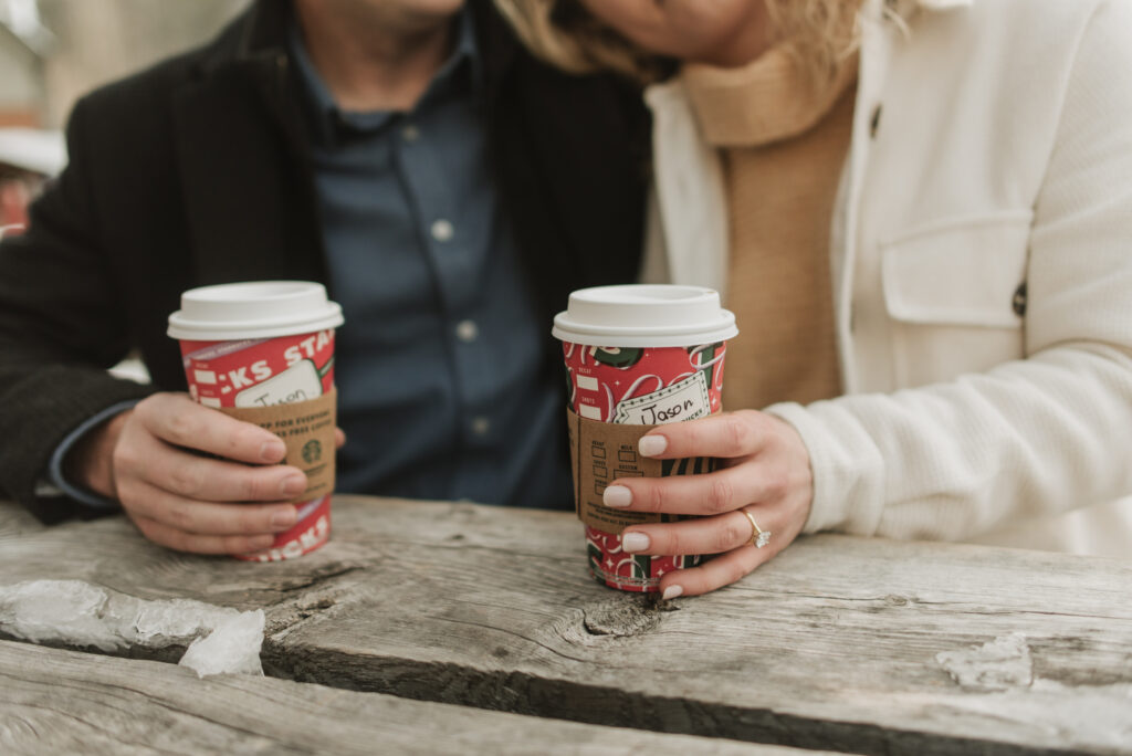 snowy colorado mountain winter engagement photos at keystone with starbucks coffee