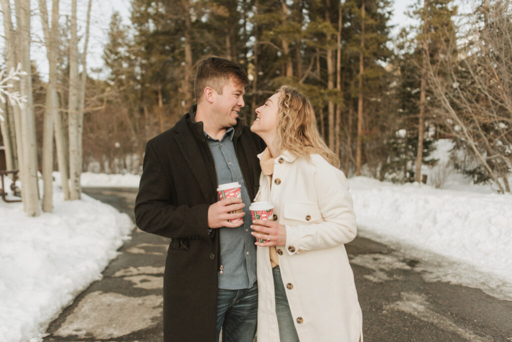 snowy colorado mountain winter engagement photos at keystone with starbucks coffee