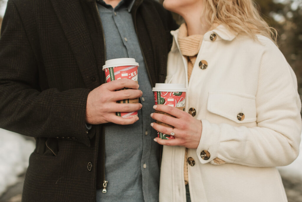 snowy colorado mountain winter engagement photos at keystone with starbucks coffee